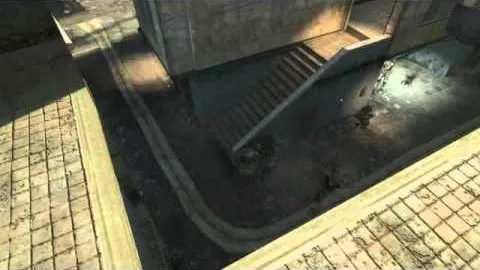 An overhead view of concrete steps and a paved walkway, with bodies at the foot of the stairs.